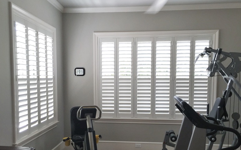 Indianapolis home gym with shuttered windows.